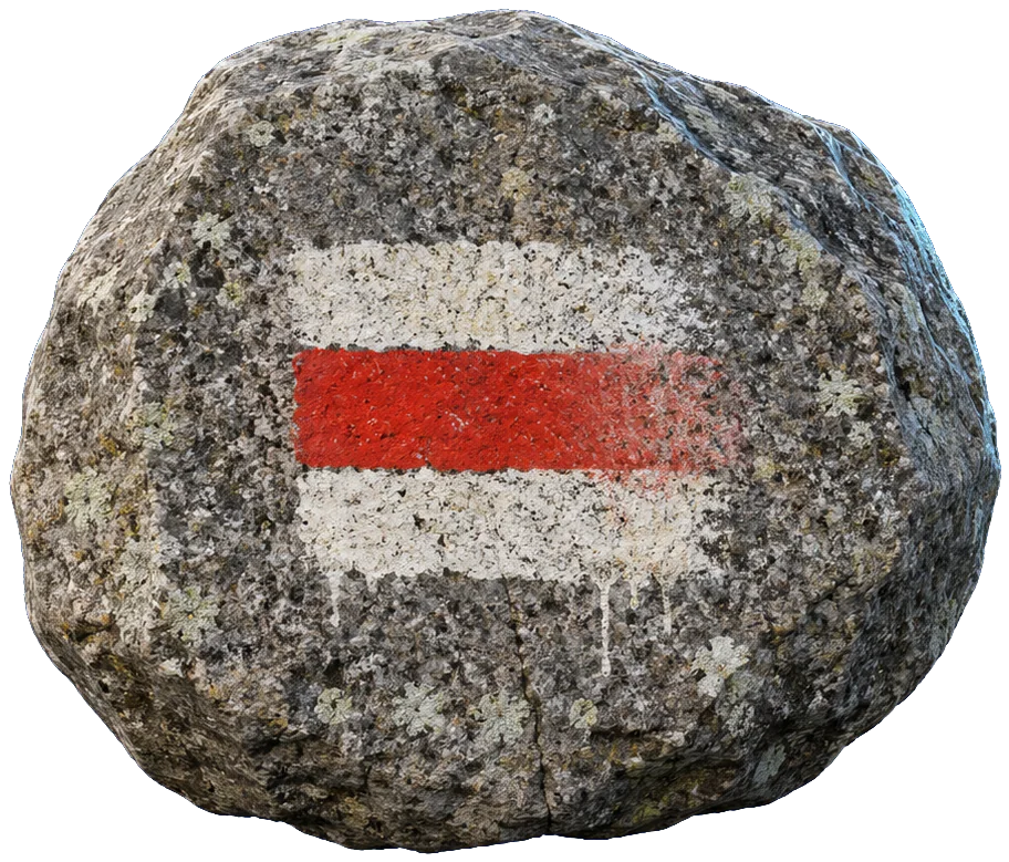 A red blaze — a band of red paint between two bands of white — hand-painted on a granite boulder.